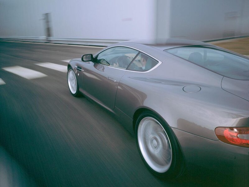 silver sports car in motion