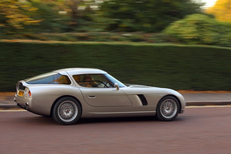 silver sports car in motion