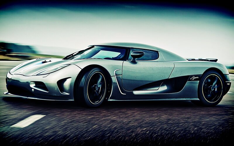 silver sports car in motion