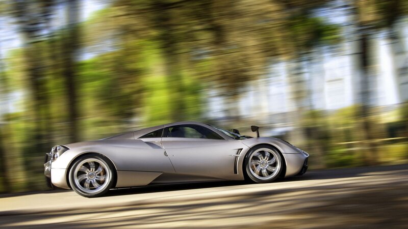 silver sports car in motion