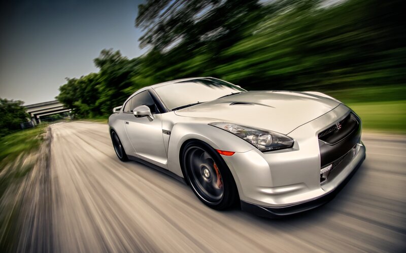 silver sports car in motion
