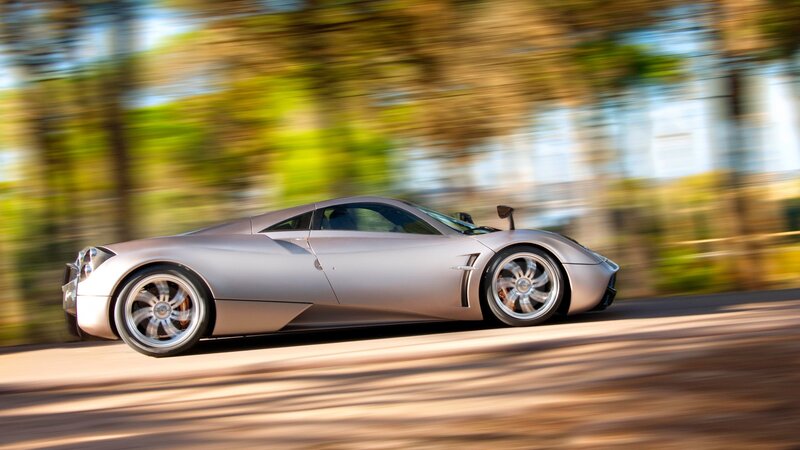 silver sports car in motion