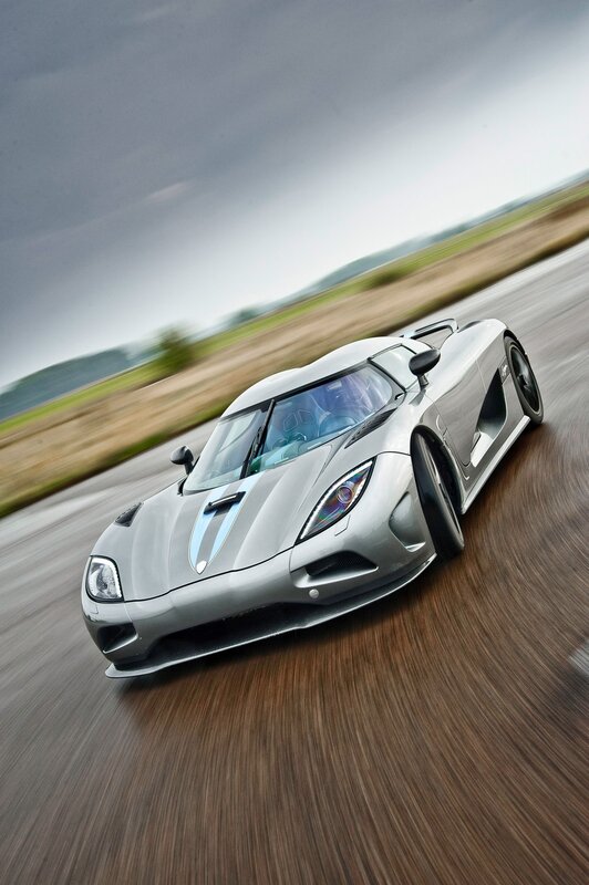 silver sports car in motion