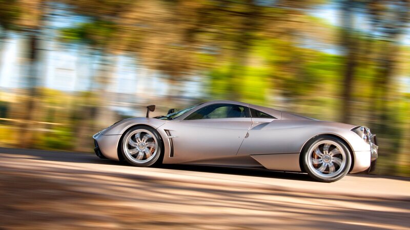silver sports car in motion