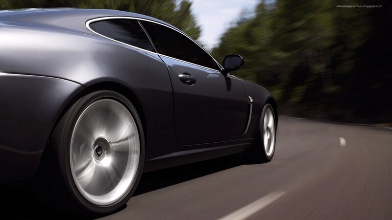 silver sports car in motion
