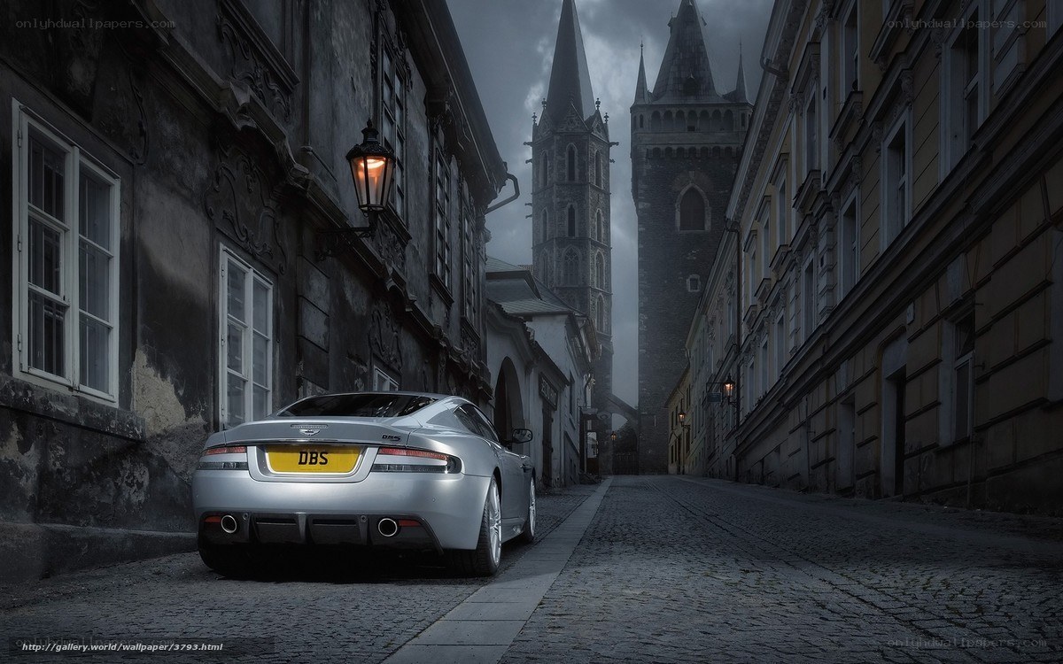 Silver sports car in old city