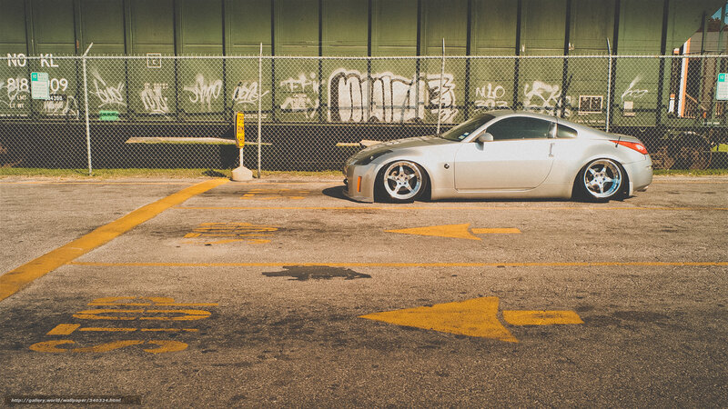 silver sports car in parking lot