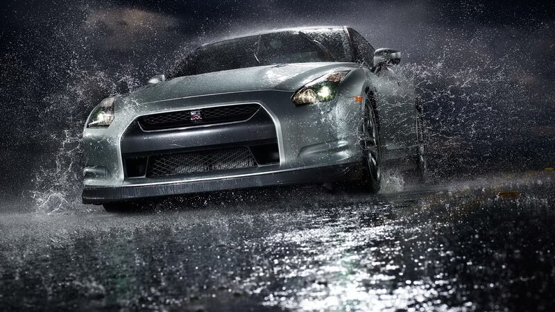 silver sports car in rain