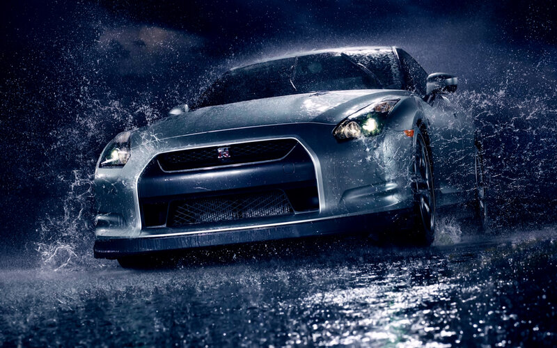 silver sports car in rain
