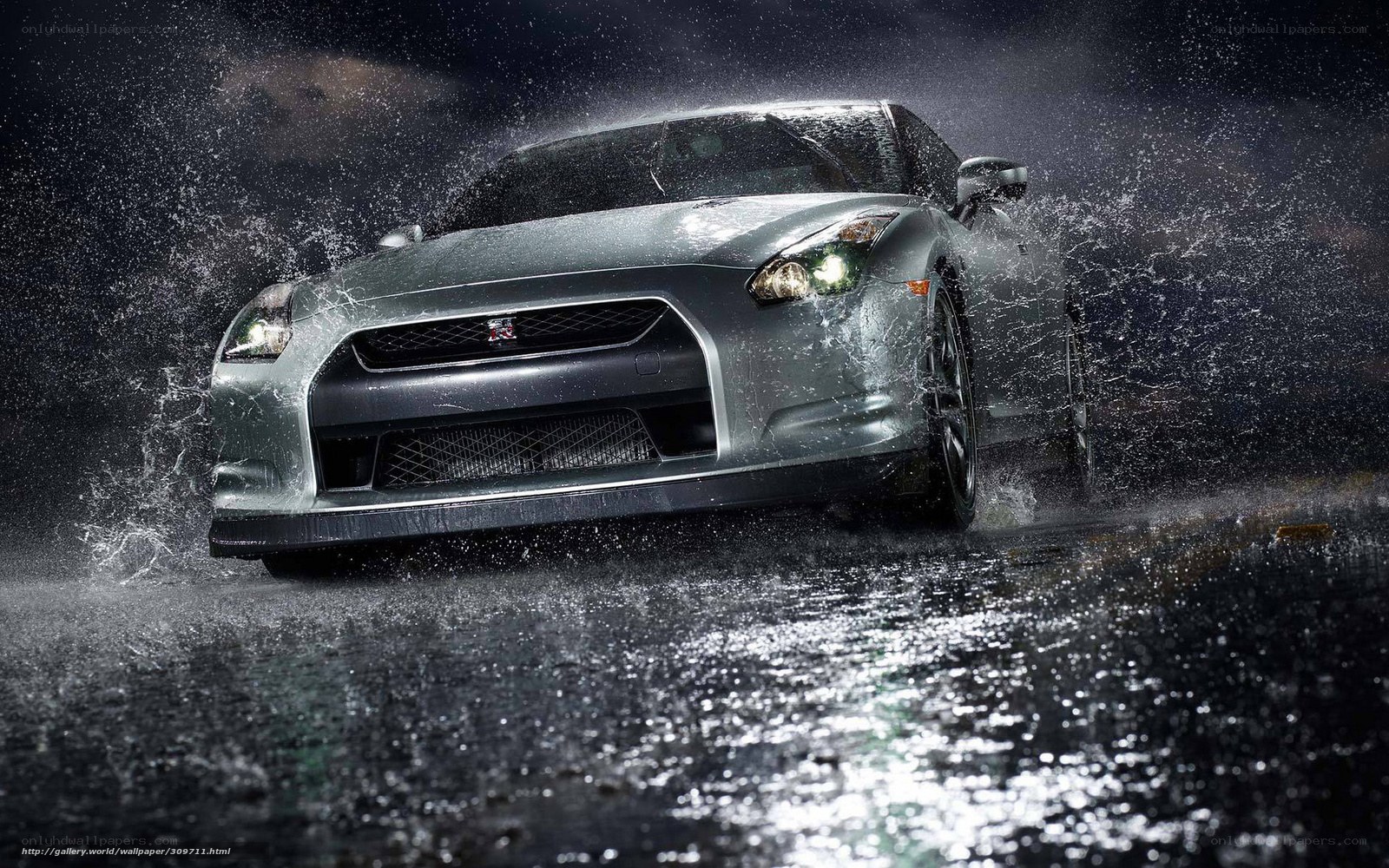 Silver sports car in rain