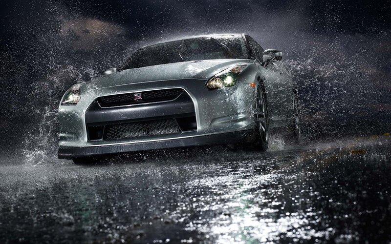 Silver sports car in rain