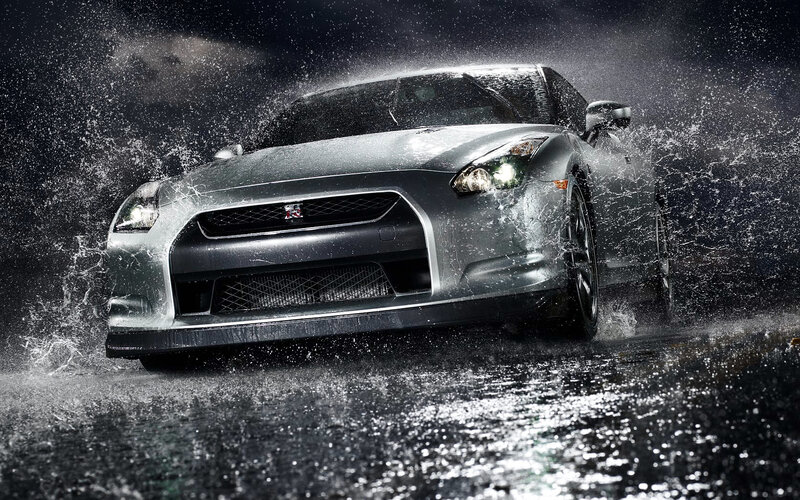 silver sports car in rain