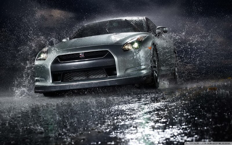 silver sports car in rain