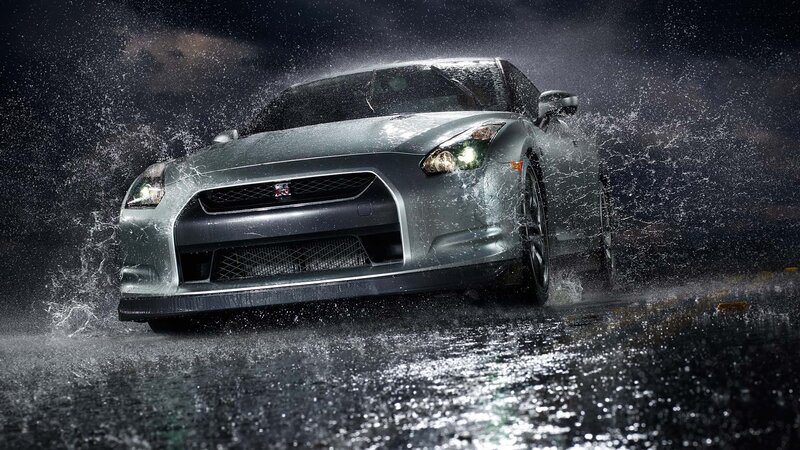 silver sports car in rain