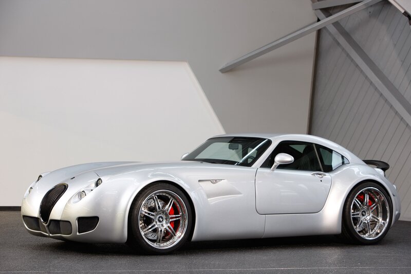 silver sports car in showroom
