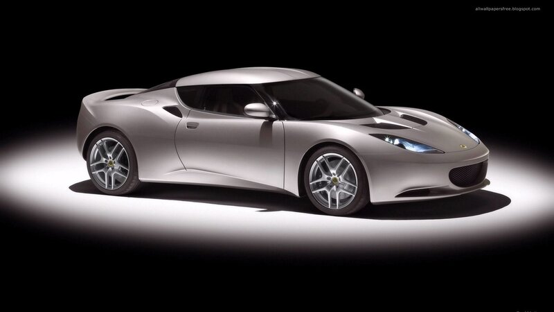 silver sports car in spotlight