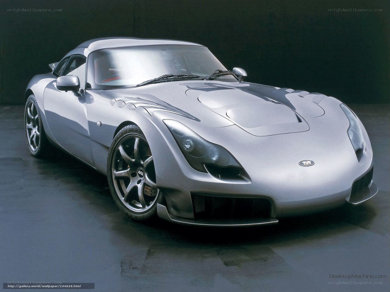 silver sports car in studio