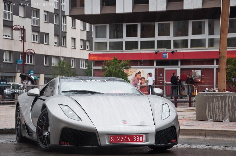 Silver sports car in the rain