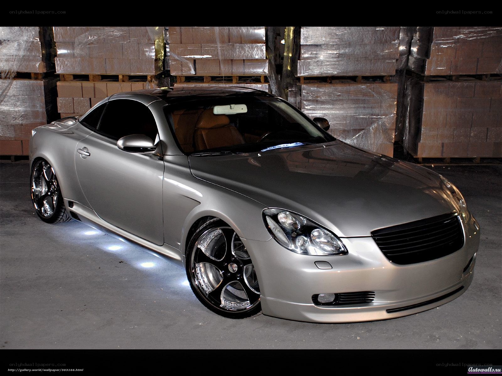 silver sports car in warehouse