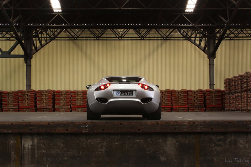 Silver sports car in warehouse