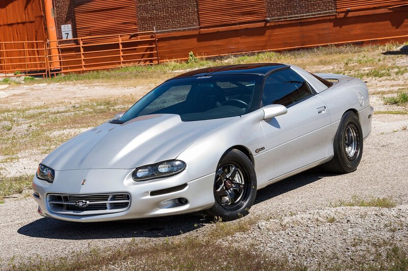 Silver Sports Car — Neutral, Afternoon, Photograph, Building, Fence