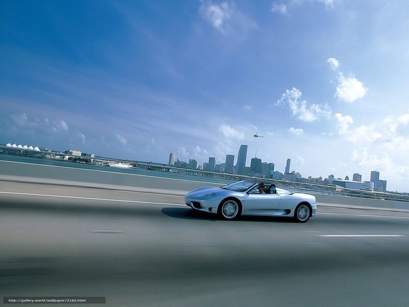 Silver sports car on a bridge