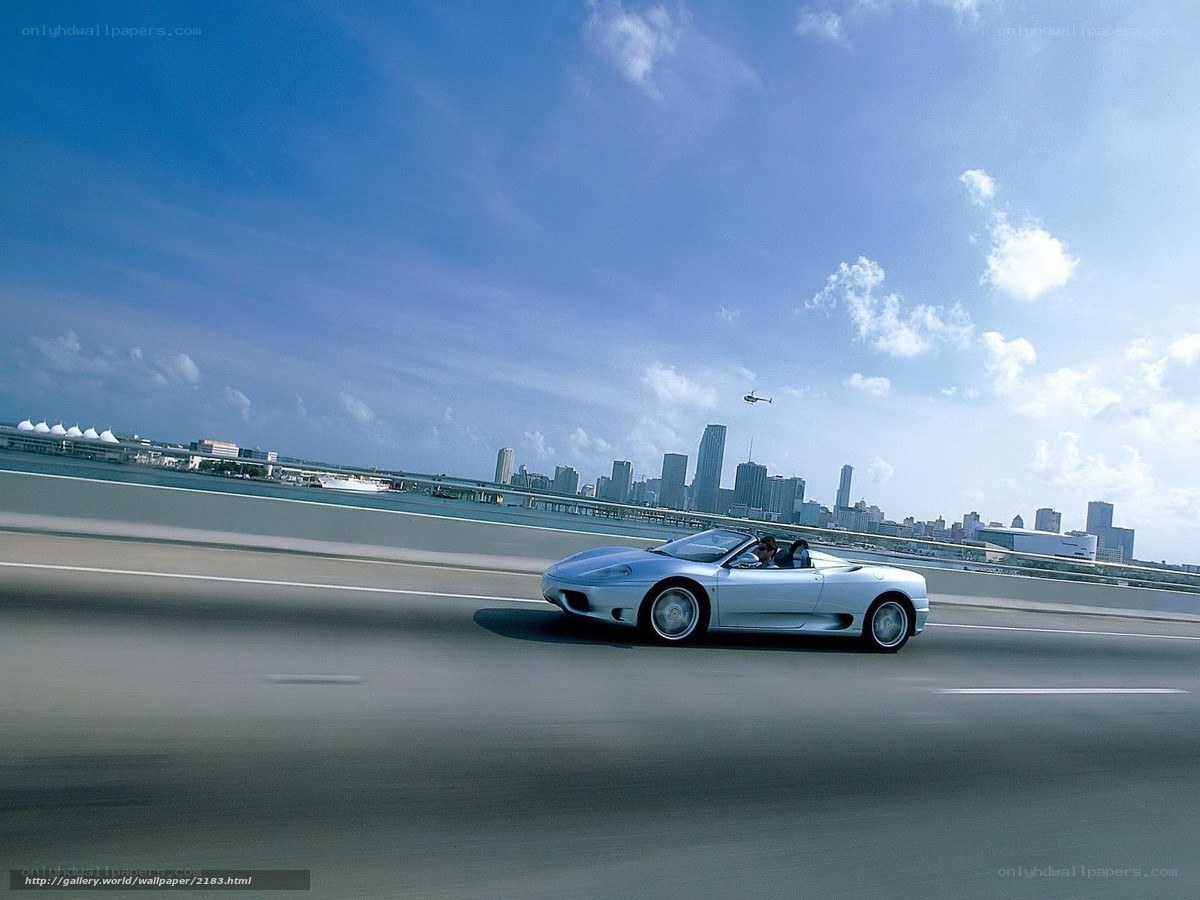 Silver sports car on a bridge