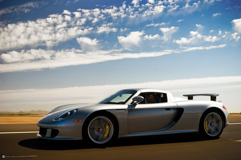 Silver sports car on a desert road