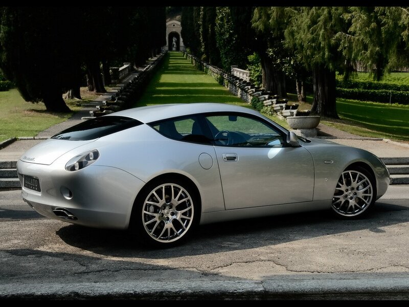silver sports car on a driveway