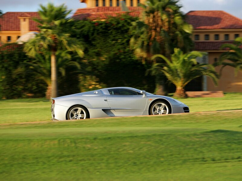 Silver sports car on a golf course