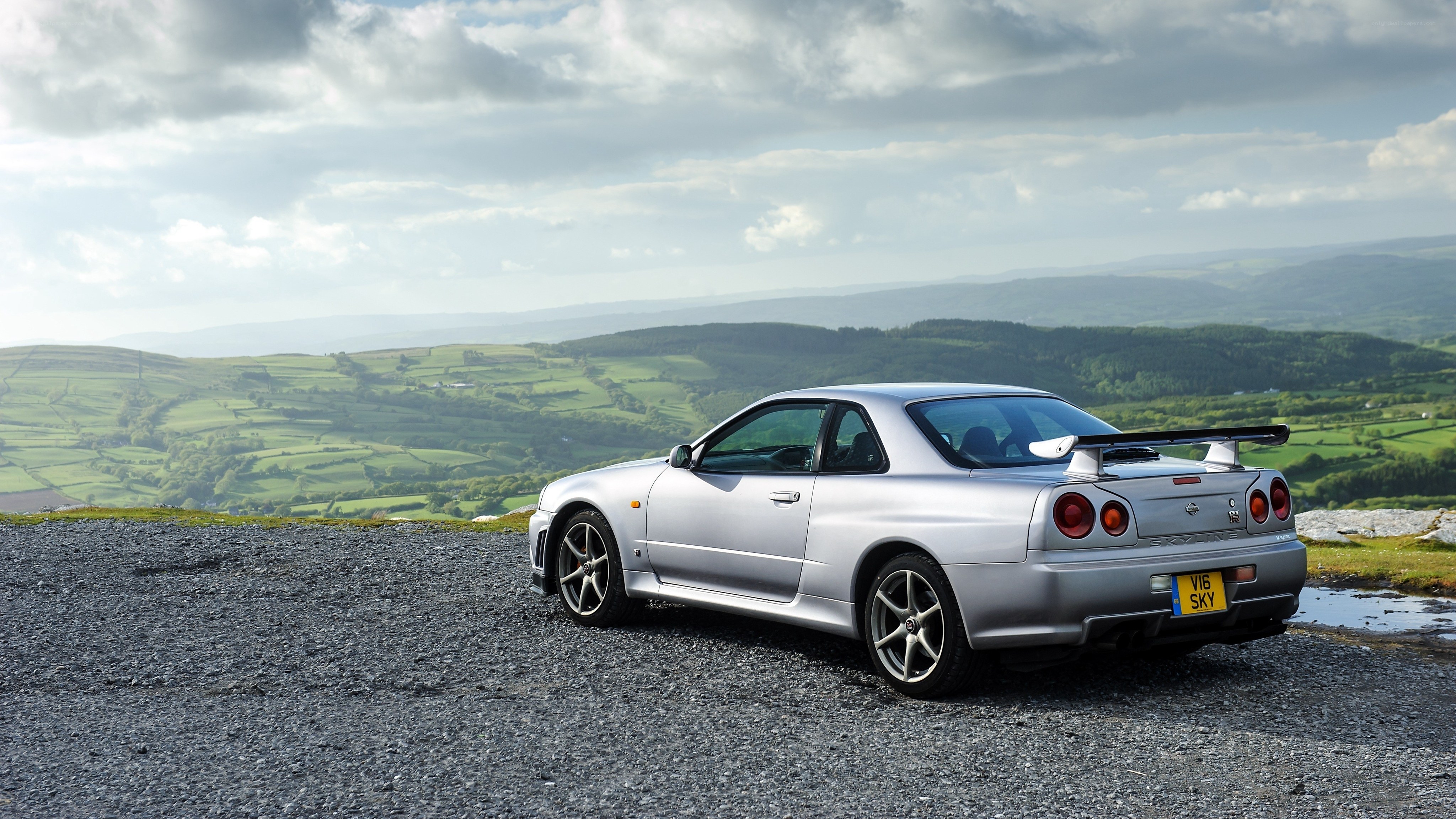 Silver sports car on a hill