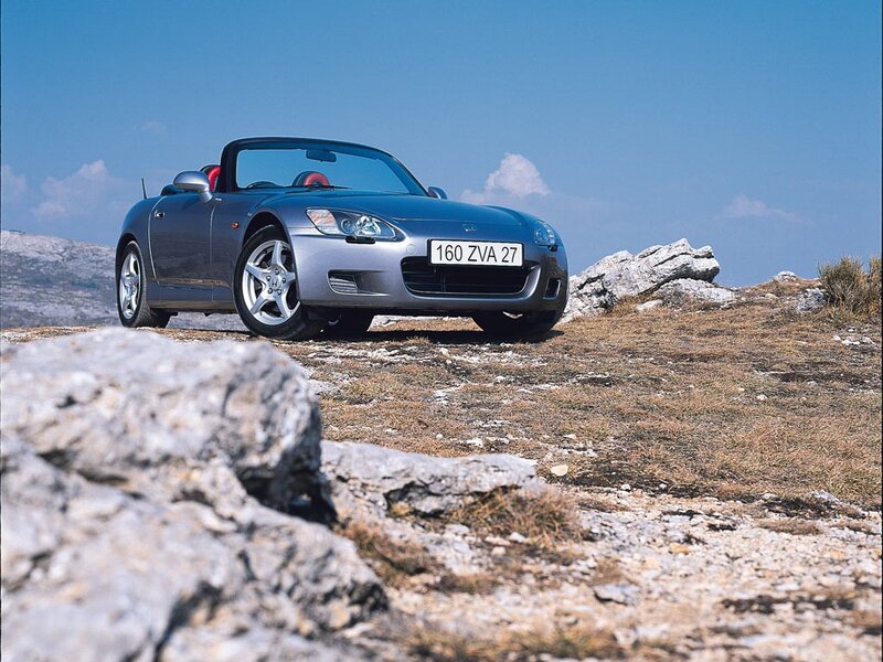 Silver sports car on a hill