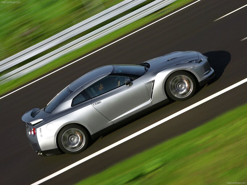 Silver sports car on a racetrack