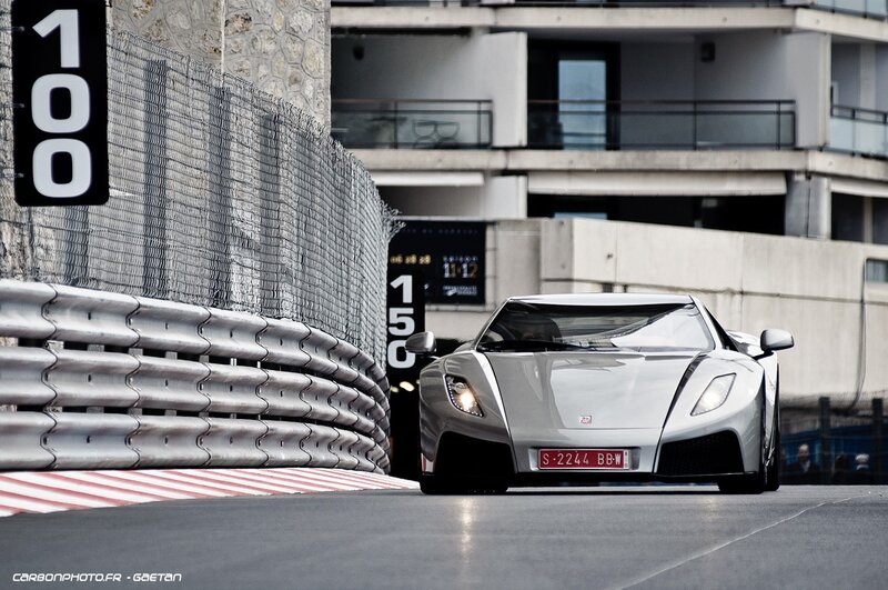 Silver sports car on a racetrack