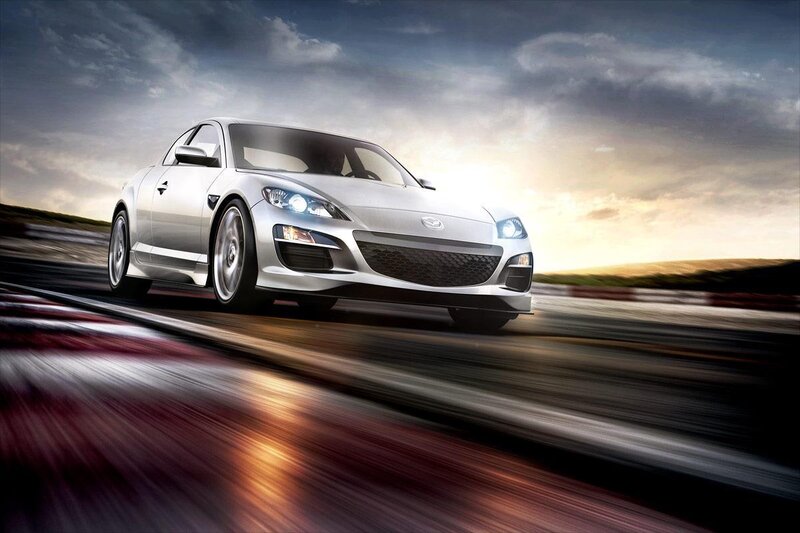 Silver sports car on a racetrack