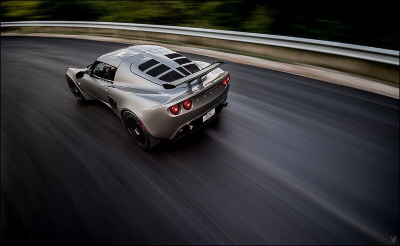 silver sports car on a racetrack