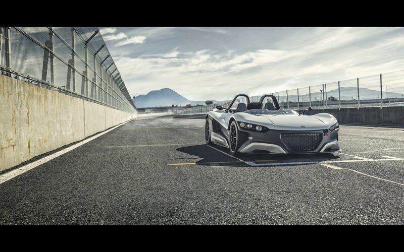 Silver sports car on a racetrack