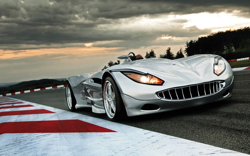 Silver sports car on a racetrack