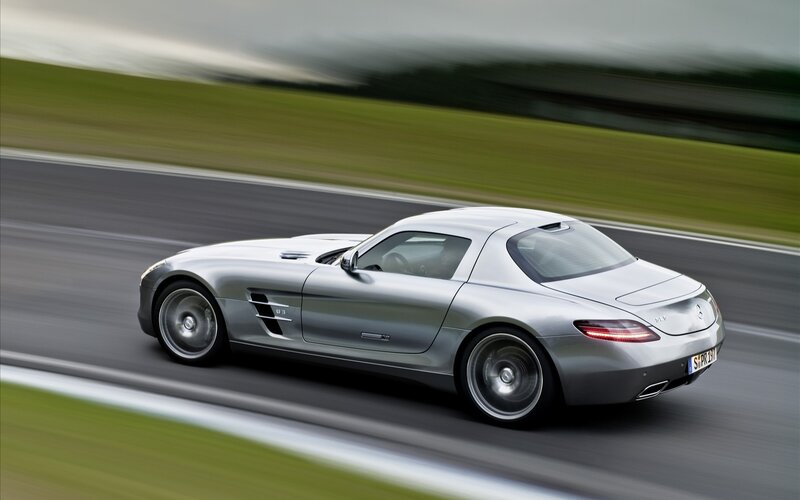 Silver sports car on a racetrack