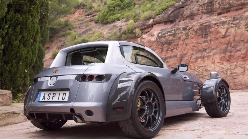 silver sports car on a road