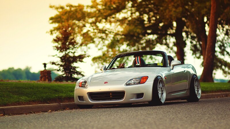 silver sports car on a road