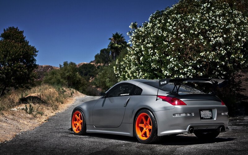 silver sports car on a road