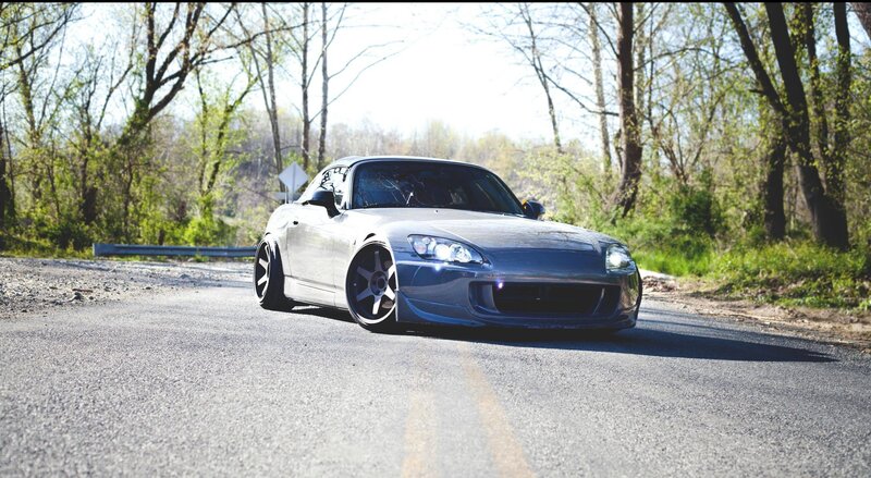 silver sports car on a road