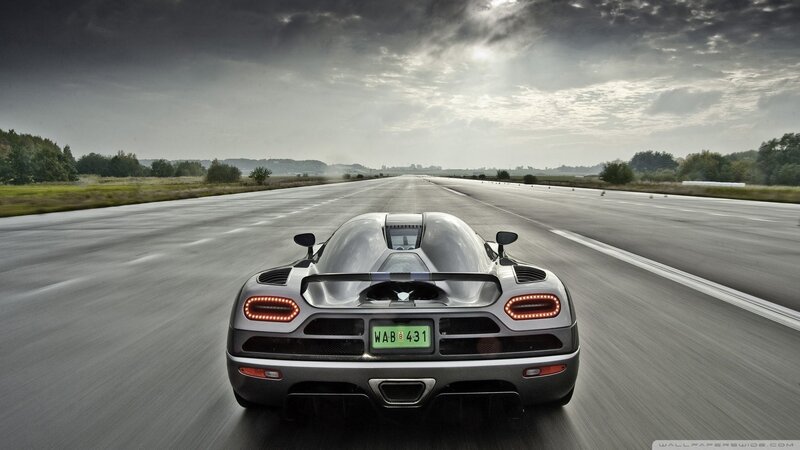 silver sports car on a runway