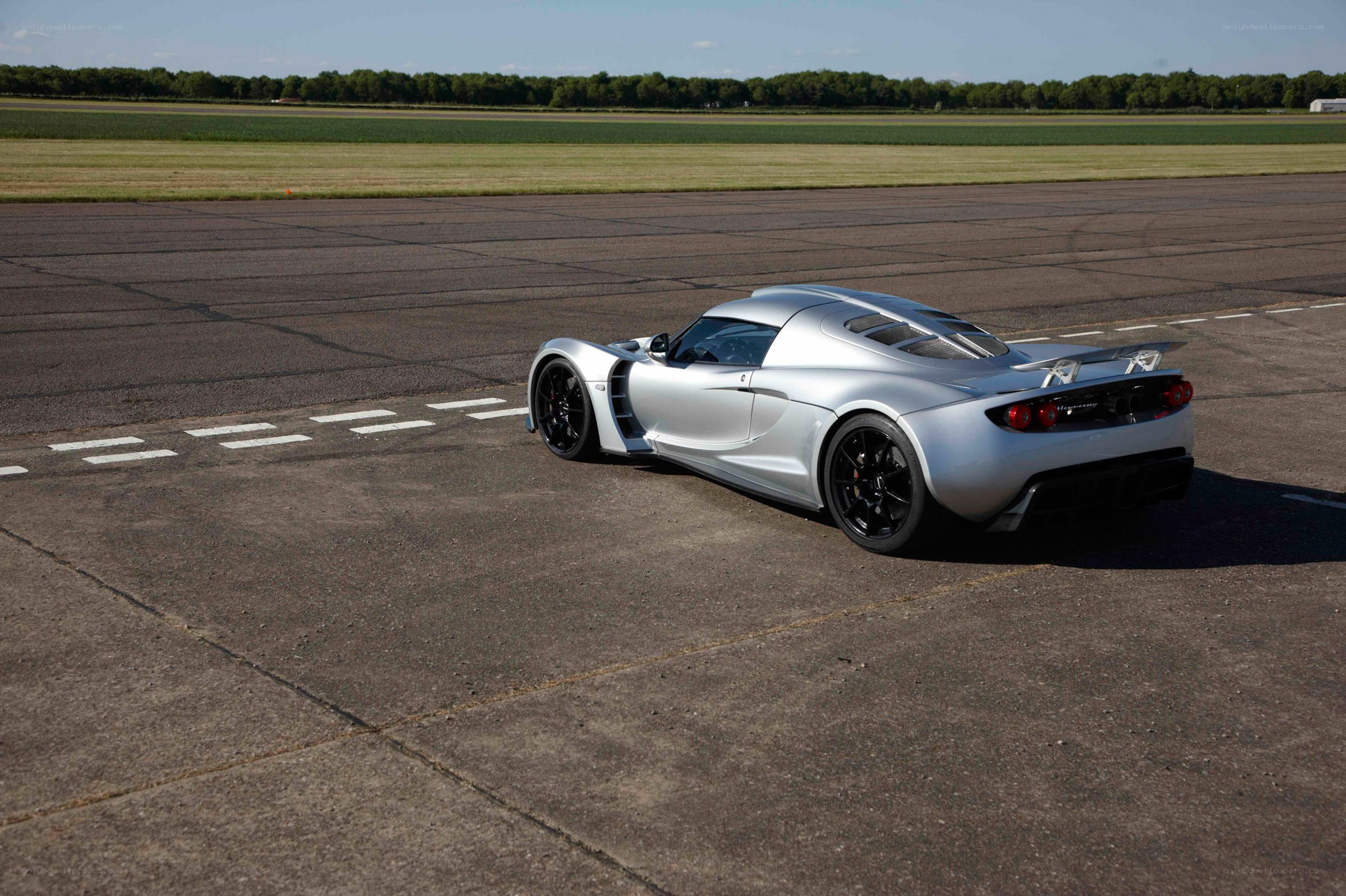 Silver sports car on a runway