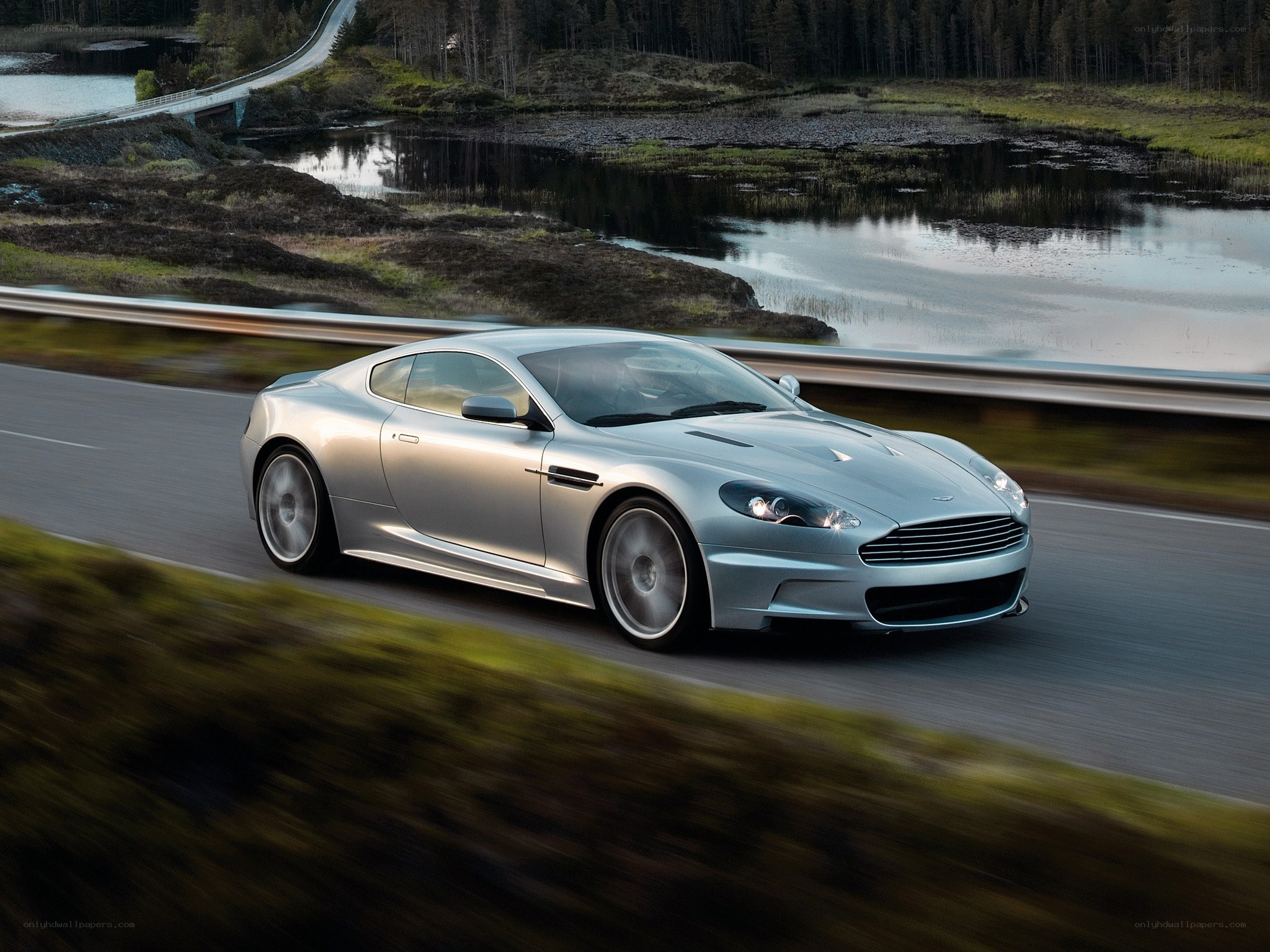 silver sports car on a scenic road
