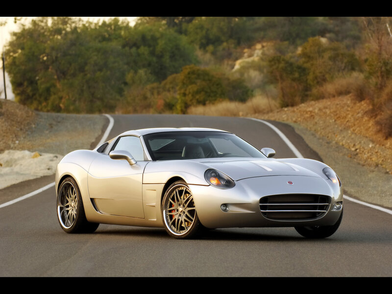 Silver sports car on a winding road