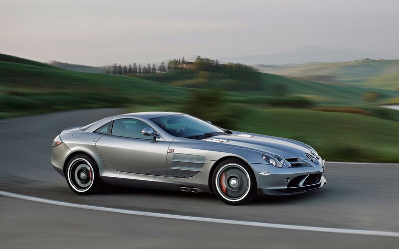 Silver sports car on a winding road