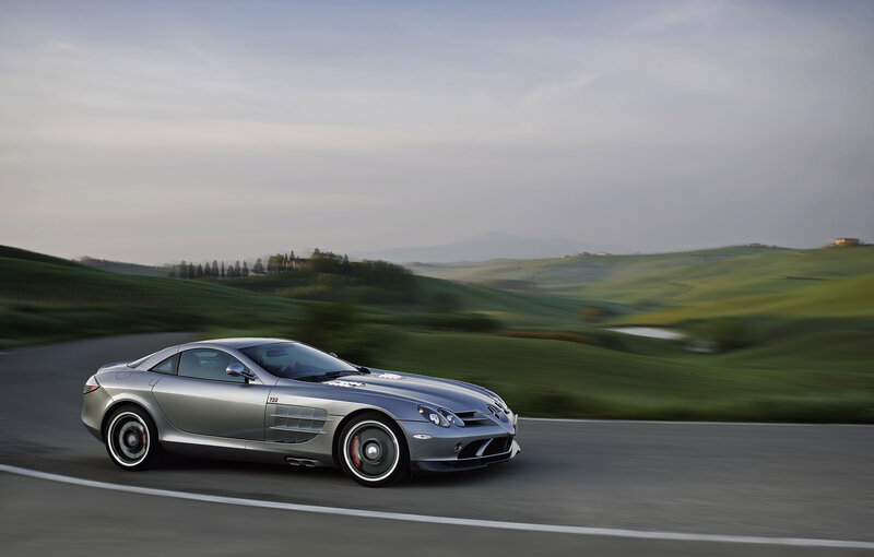 Silver sports car on a winding road