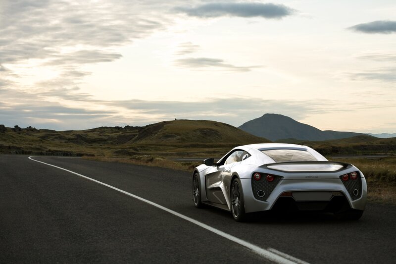 Silver sports car on a winding road